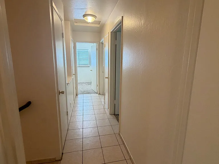 Upstairs Hallway with Storage Closet that leads to the 2 Other Bedrooms