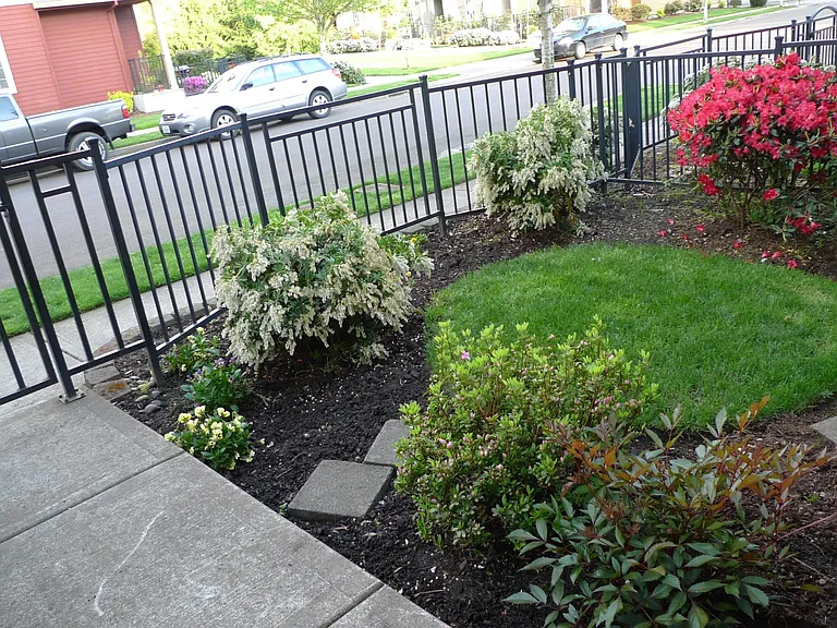 front view. fenced front yard with landscape maintenance included