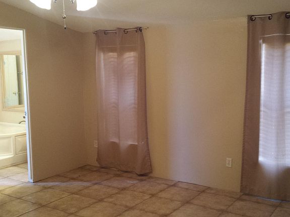 Master bedroom peeking in at the garden tub