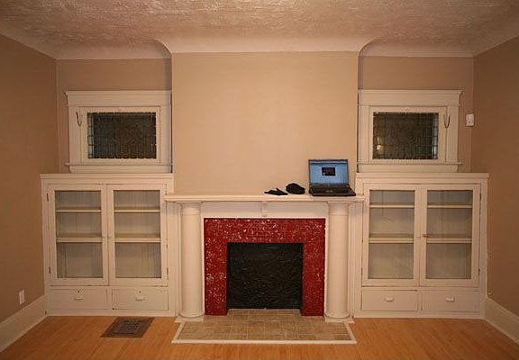 Lovingly restored original built-in cabinets in the living room serve as a stunning focal point.