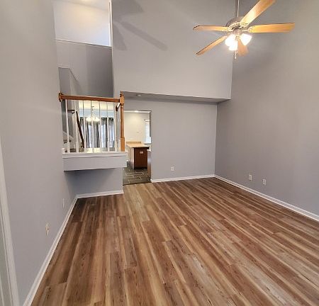 The living room has a vaulted ceiling.