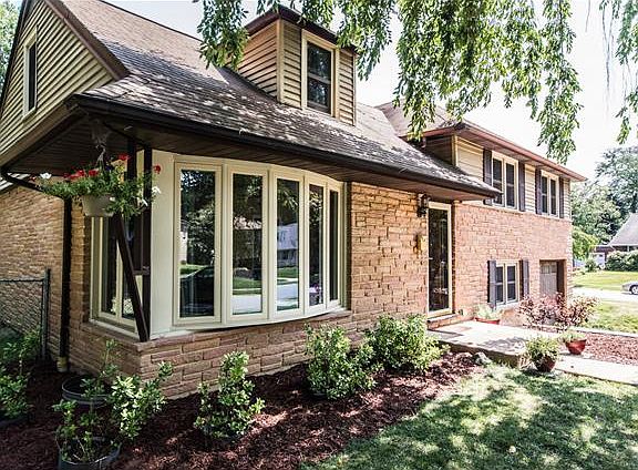 Fresh landscaping and lush lawn create curb appeal