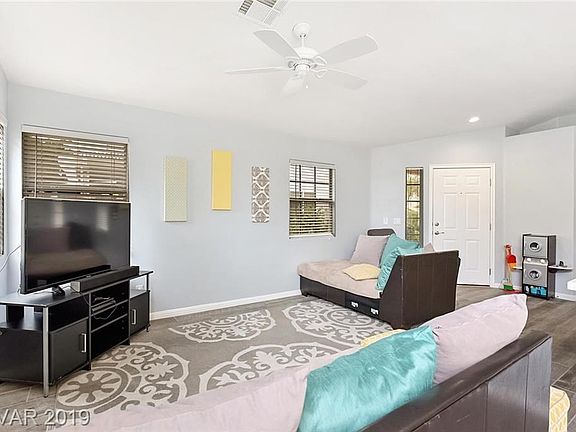 Family room with wood like tile floor and soft colors...getting better