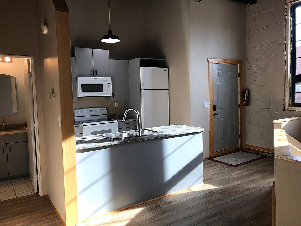 Updated Kitchen Including: Counter, Stove, Microwave, Sink/Faucet.