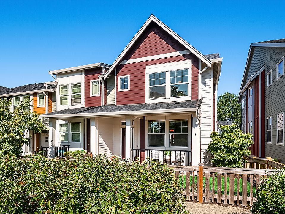 This stylish end-unit townhome boasts with charm immediately from its front door and covered front porch. Your new home awaits!