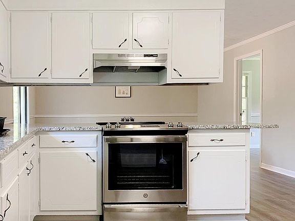 Renovated Kitchen with stainless steel appliances and granite counters