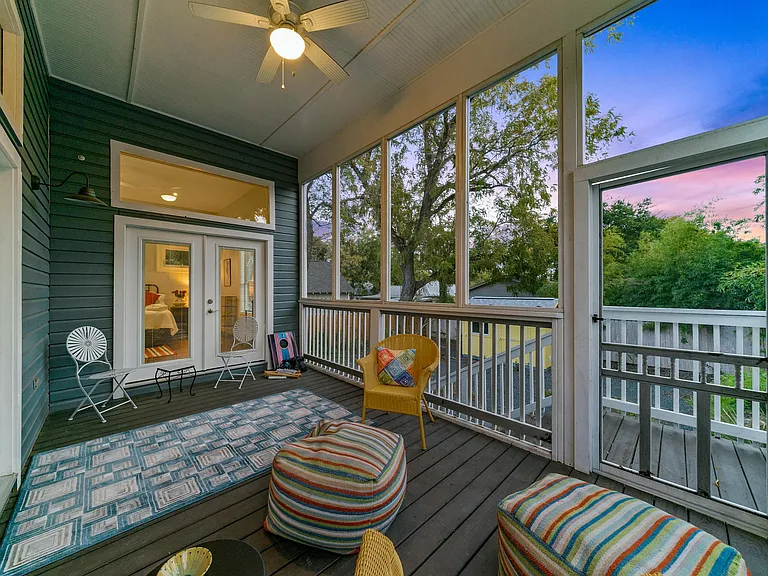 Screened in porch keeps out the mosquitos. Remarkably tranquil for a home this close to all the action.