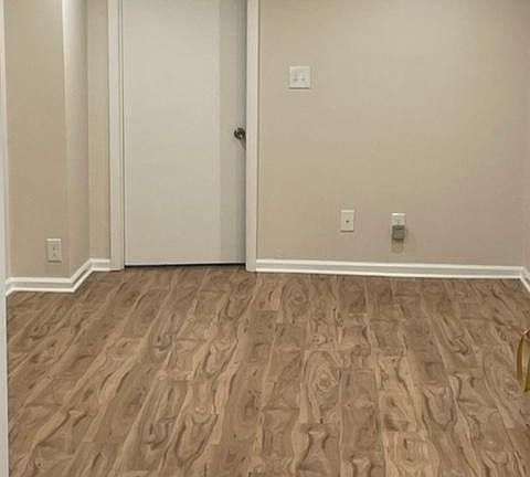 large living area that leads into the bedroom