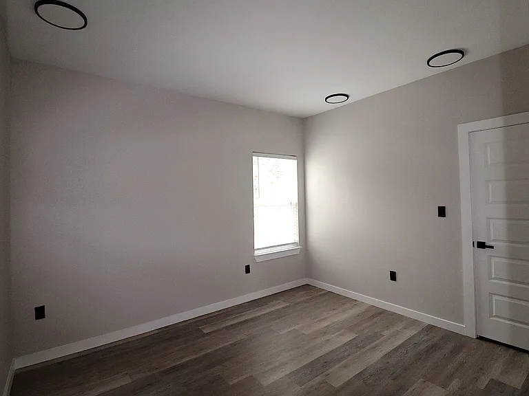 Bedroom 2 of 4 with a spacious closet, contemporary finishes, and a bright, comfortable layout.