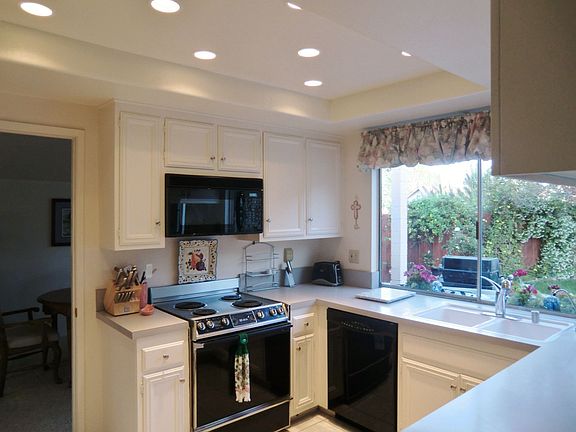 Kitchen looks out on backyard