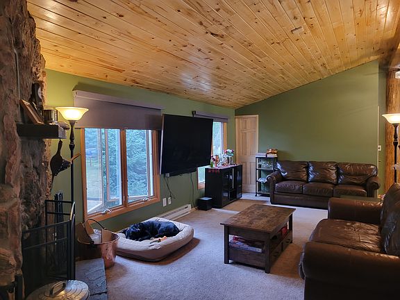 Upstairs living room with natural light and room for two couches, chairs, TV wall space, and more. Dog not included.