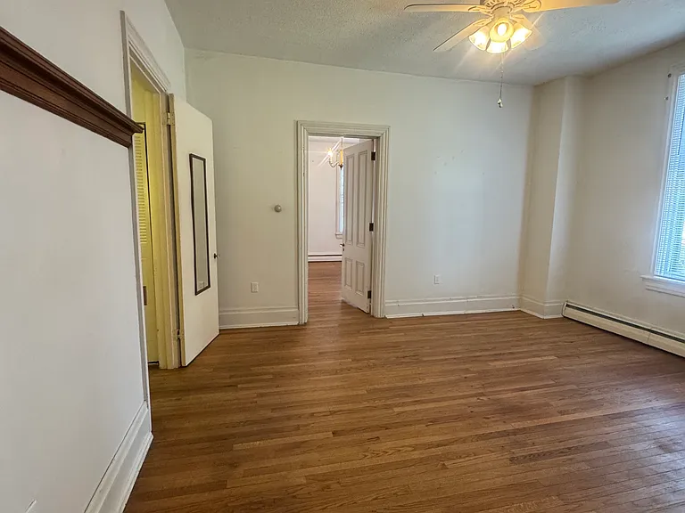 livingroom enters bedroom; enter bathroom on left