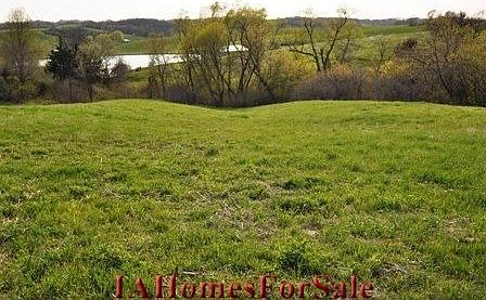 North- looking SW across lot to a very scenic view of neighboring pond, or have your own pond built.