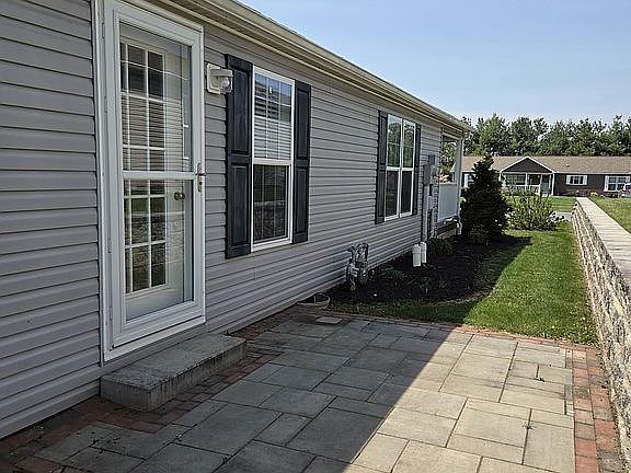 Side of home with patio