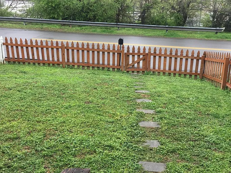 Fenced in front yard facing 3rd Ave N