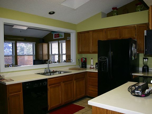 Kitchen Features Tile Floors and Skylights