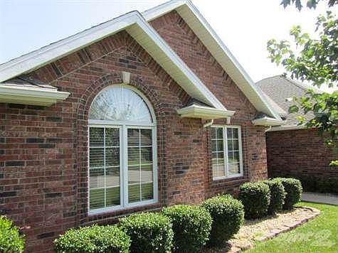 Nice landscaping surrounds the home and yard.