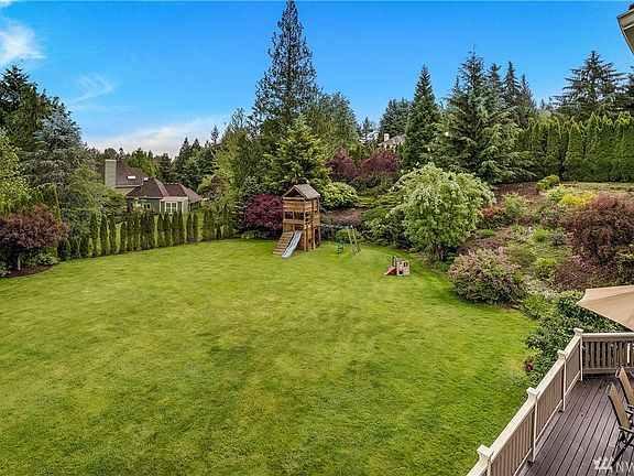 Expansive and private yard and deck.  Your own park-like setting with fruit trees, garden space, smart sprinkler system and views of the nearby mountains. Community access to trail-heads.