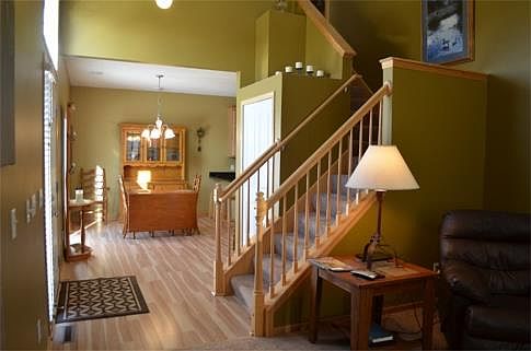 Main entrance at the side brings you into a big open foyer with soaring vaults. The first thing you'll notice is all new flooring throughout and fresh paint.