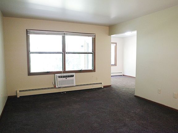 Large living room area overlooking backyard.