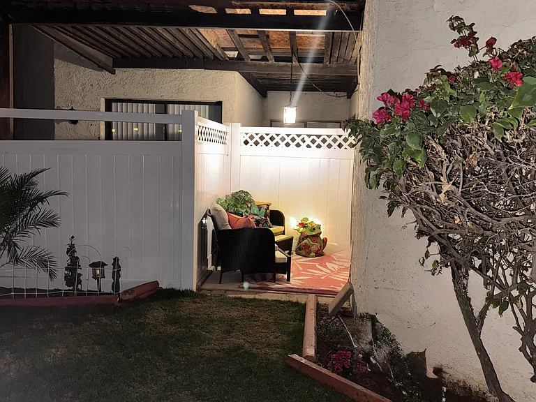 Back yards with access to the patio and master bedroom.