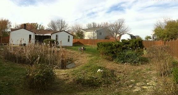 Rear of home, pond, yard