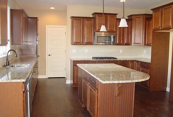 The New Haven B with island and hardwood floors