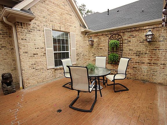 Private courtyard porch has custom Sunsetter awning.