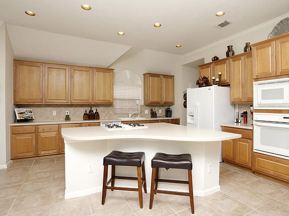 This is a kitchen any chef would love! Huge island kitchen provides great work space, eating or homework.