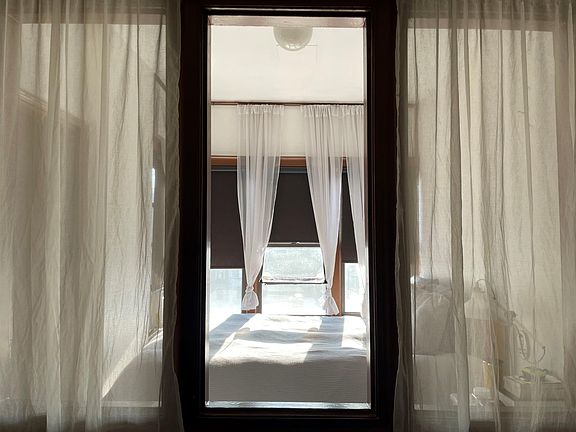 Bedroom through framed divider