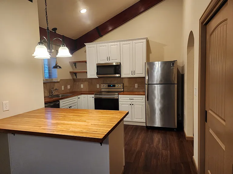 Kitchen door to right is the pantry