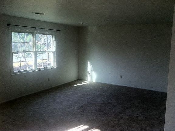 New carpet well lit living room
