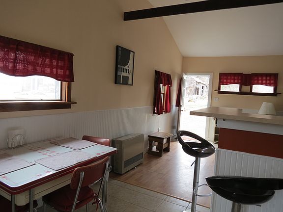 Dining table plus counter seating with three stools