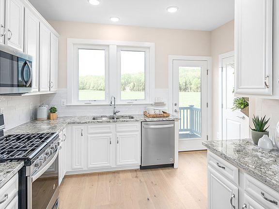 Stunning Kitchen with Granite Counters and KitchenAid Appliances