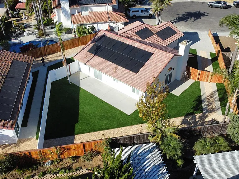 Immaculately landscaped yard with fenced in backyard. Solar panels for your utilities, Brand new roof,