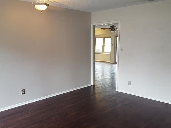 From the front door, a large living room leads into the family room and kitchen area