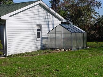 Greenhouse next to garage