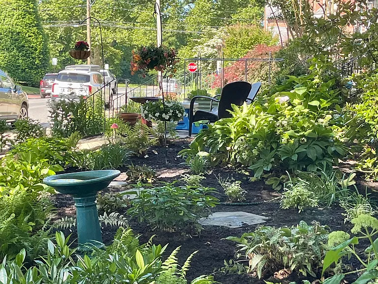 Surrounded by gracious landscaping.