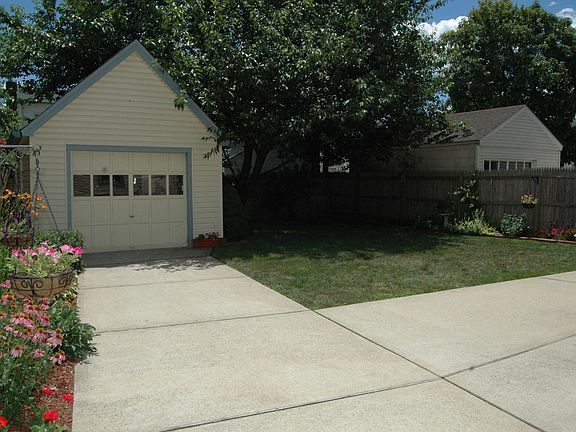 View of backyard and garage