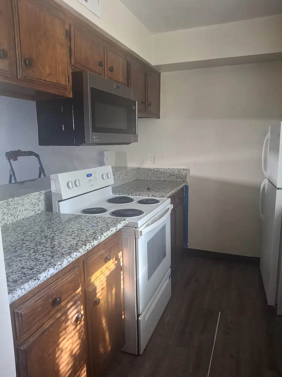 Kitchen stove and built-in microwave to maximize counter space area. - 2416 Eric Way #B