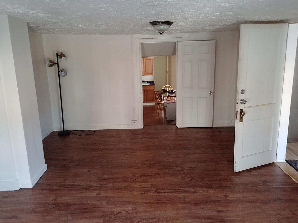 Front door on second floor enters the living room. Brand new flooring installed
