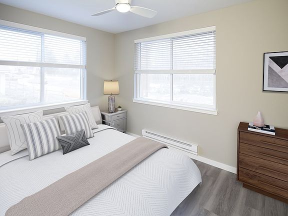 Bedroom with ceiling fan and hard surface flooring