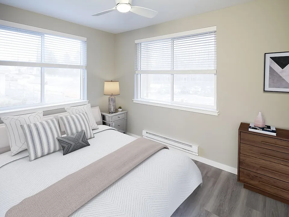 Bedroom with ceiling fan and hard surface flooring