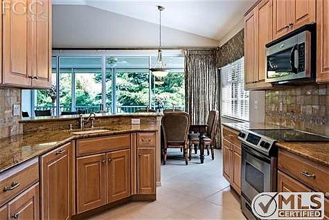 Kitchen, breakfast bar. Eat in kitchen area in background