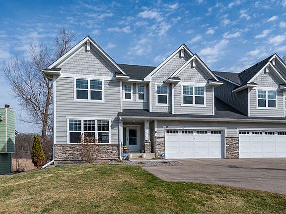Connected only by the garage, this twin home lives like a single-family residence and sits on a nearly 1-acre lot backing up to protected wetlands_offering peaceful views and a rare sense of seclusion