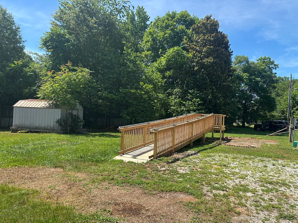 Full view of lot with building and ramp