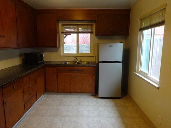 Large kitchen with refrigerator. Note - cabinets newly are