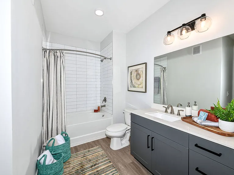 Large mirror vanities and plentiful storage in bathrooms.