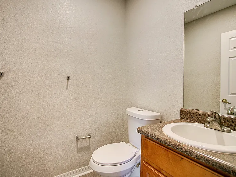 half bath with toilet and sink