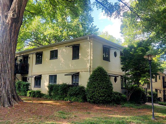 Corner first floor unit overlooking large front yard.
